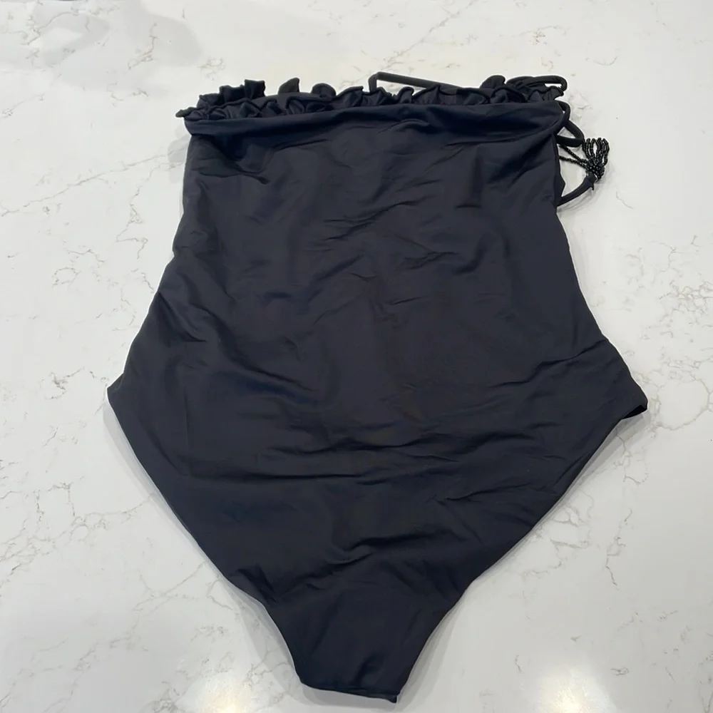 Palmacea, one piece, tied swimsuit with cut outs.
Size M - Picture 5 of 12